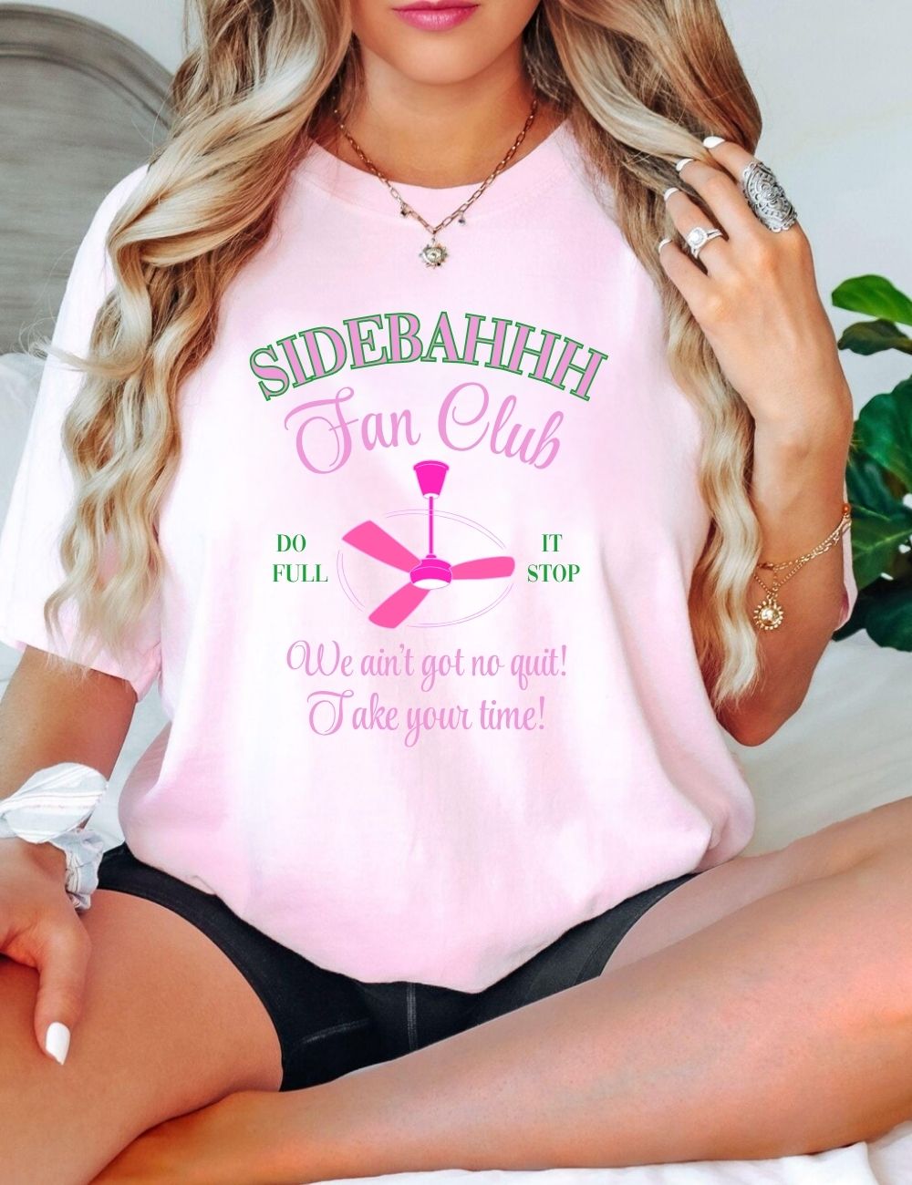 Close-up of Karen Read “Side Bahhh Fan Club” t-shirt with satirical legal design, displayed on mannequin, controversial true crime merch with cult following.